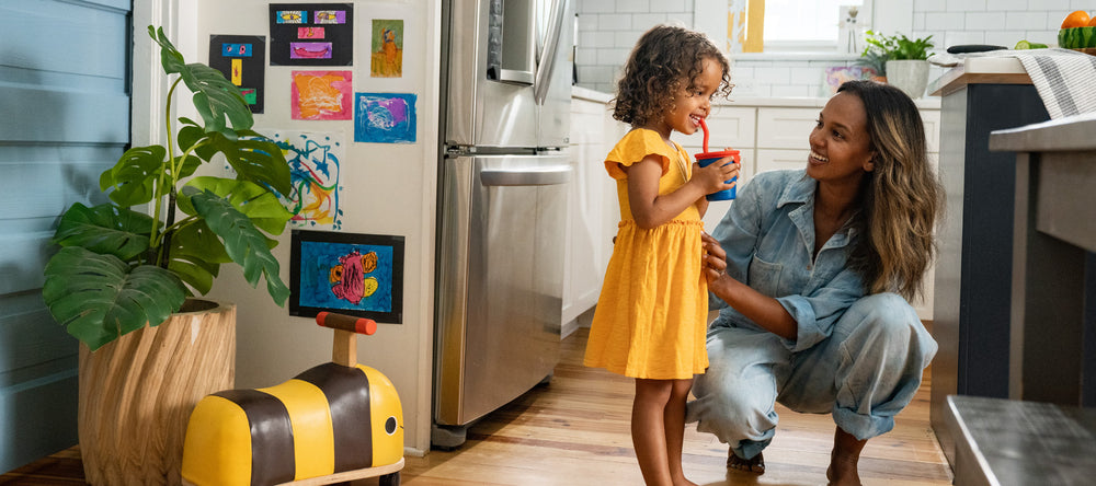 Kid's Cup with girl in kitchen